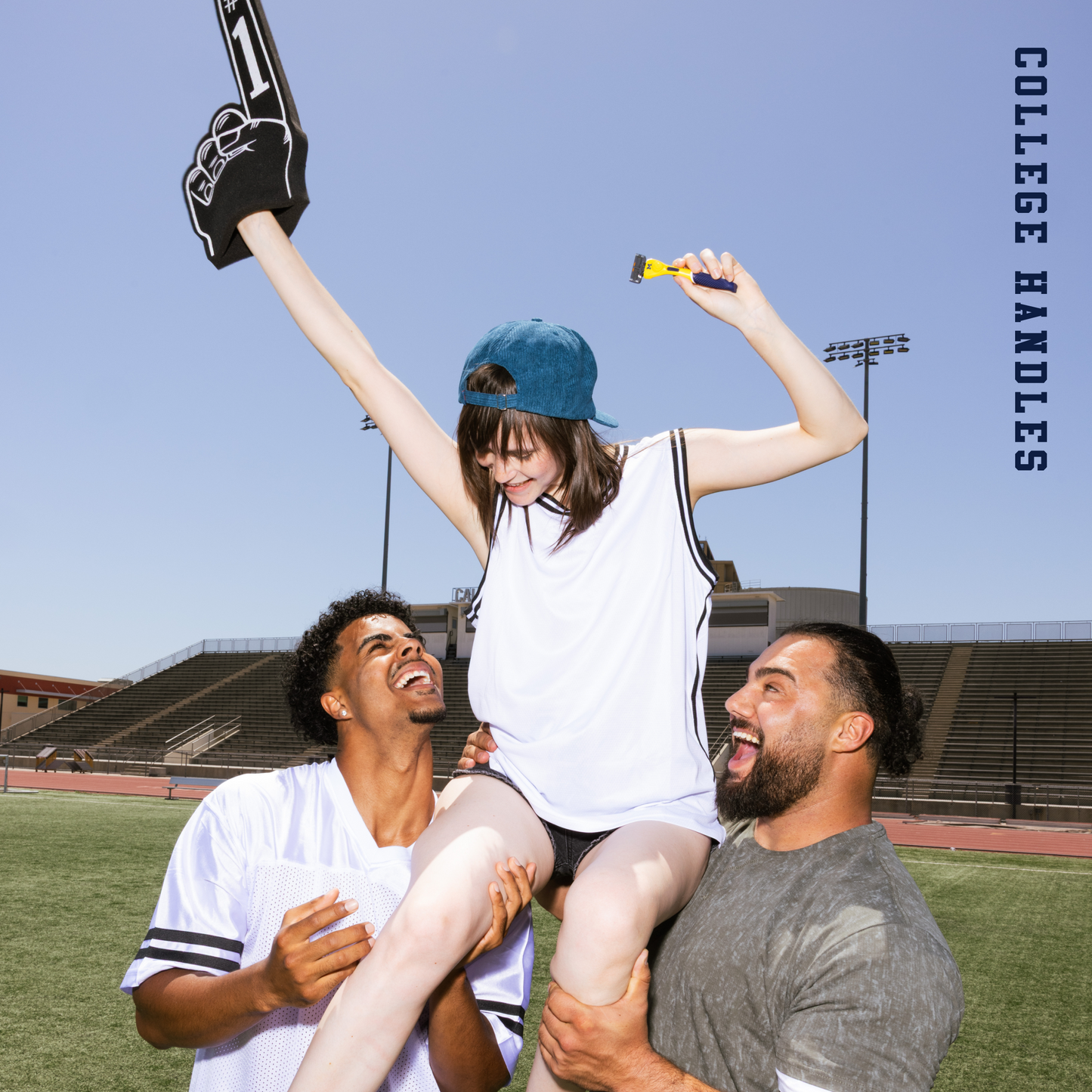 Two men lifting a woman on a sports field with 'College Handles' branding.