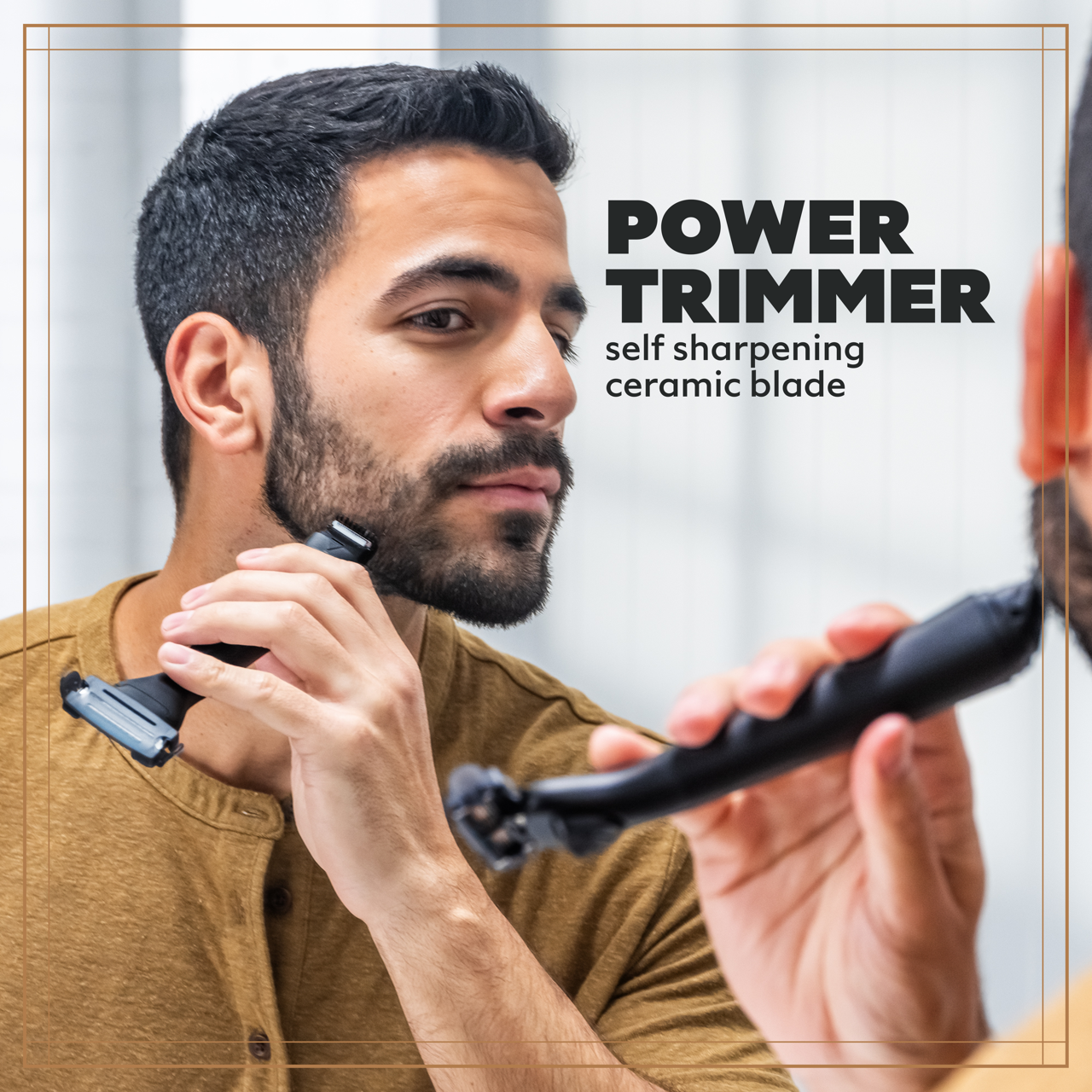 A photo of a bearded man using the trimmer end of the 3-in-1 Freestyler on his beard.