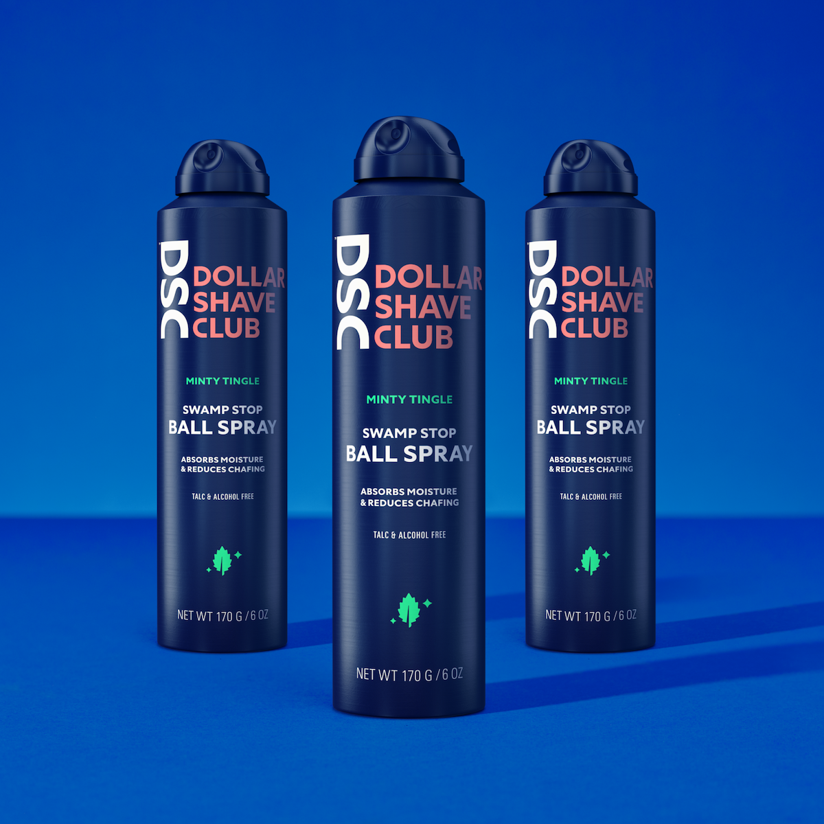 Dollar Shave Club Ball Spray Set of Three Against Blue Background.