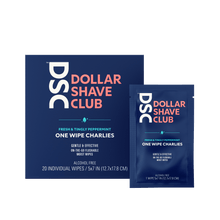 Dollar Shave Club One Wipe Charlies Butt Wipes travel size against tan backdrop.