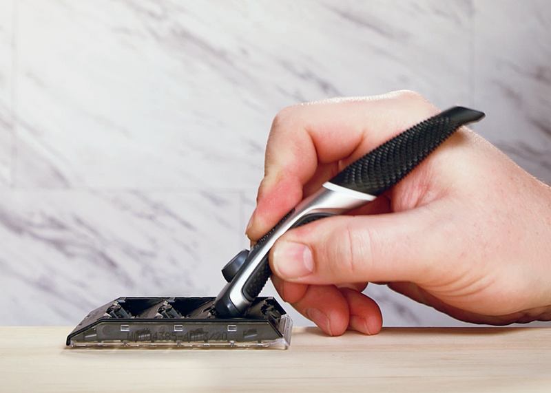 Man holding razor.