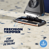 Precision trimmer with six blades on a textured surface