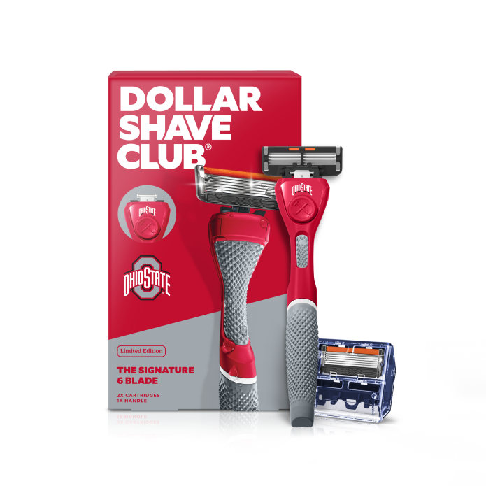 Dollar Shave Club Ohio State University grooming kit on a white background. Includes a scarlet razor handle with the OSU Buckeyes logo, 24 blades, Shave Butter, Prep Scrub, a black 3-in-1 electric trimmer, and a black traveler case.