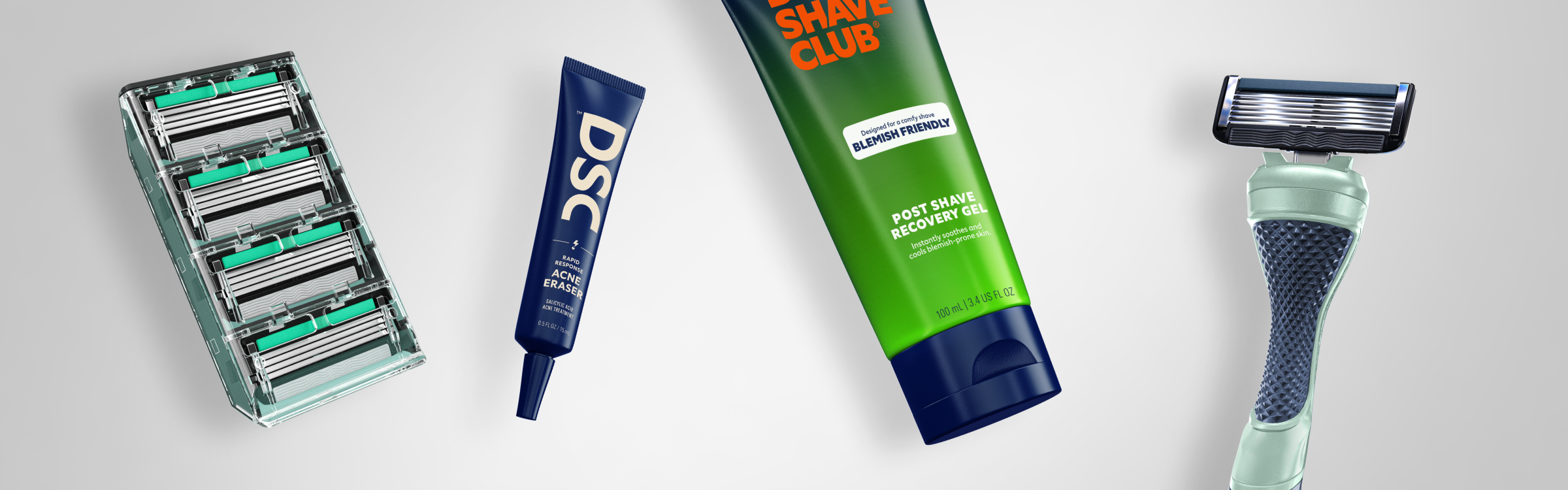 Different types of acne-friendly shaving products floating against a white background.