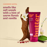 Dollar Shave Club shave butter tube with vanilla and wood elements on a beige background