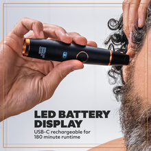 Photo of a person using the Style Detailer to trim ear hair, and displaying the LED battery display on the product