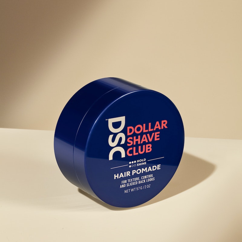 Dollar Shave Club Hair Pomade against tan backdrop.