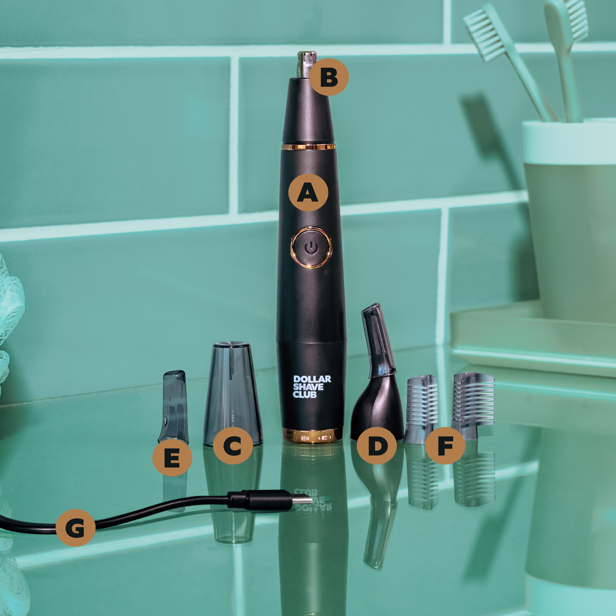 Components of the Style Detailer Precision Trimmer standing on an aquamarine-colored bathroom counter. 