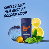 Dollar Shave Club antiperspirant with lemons and mint leaves on a blue background