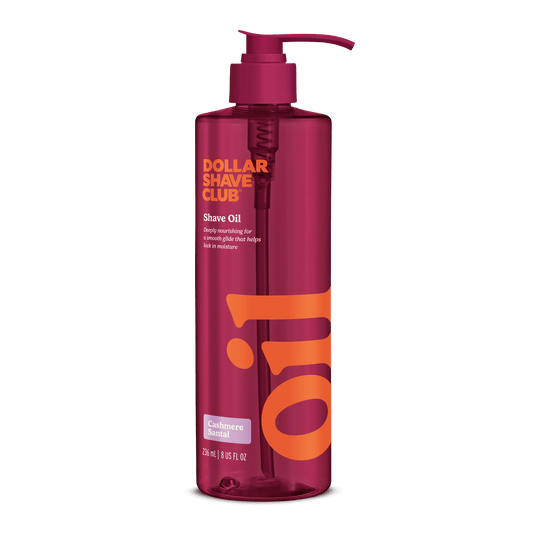 Dollar Shave Club shave oil bottle with pump on a black background, front of bottle