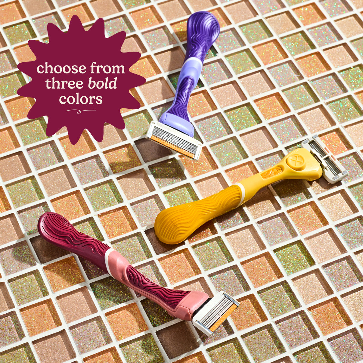 Three colorful razors on a tiled background with text 'choose from three bold colors'.