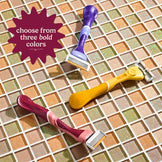 Three colorful razors on a tiled background with text 'choose from three bold colors'.