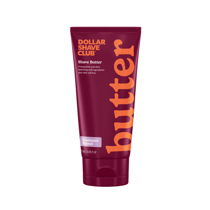 Dollar Shave Club shave butter tube with maroon and orange design on a white background