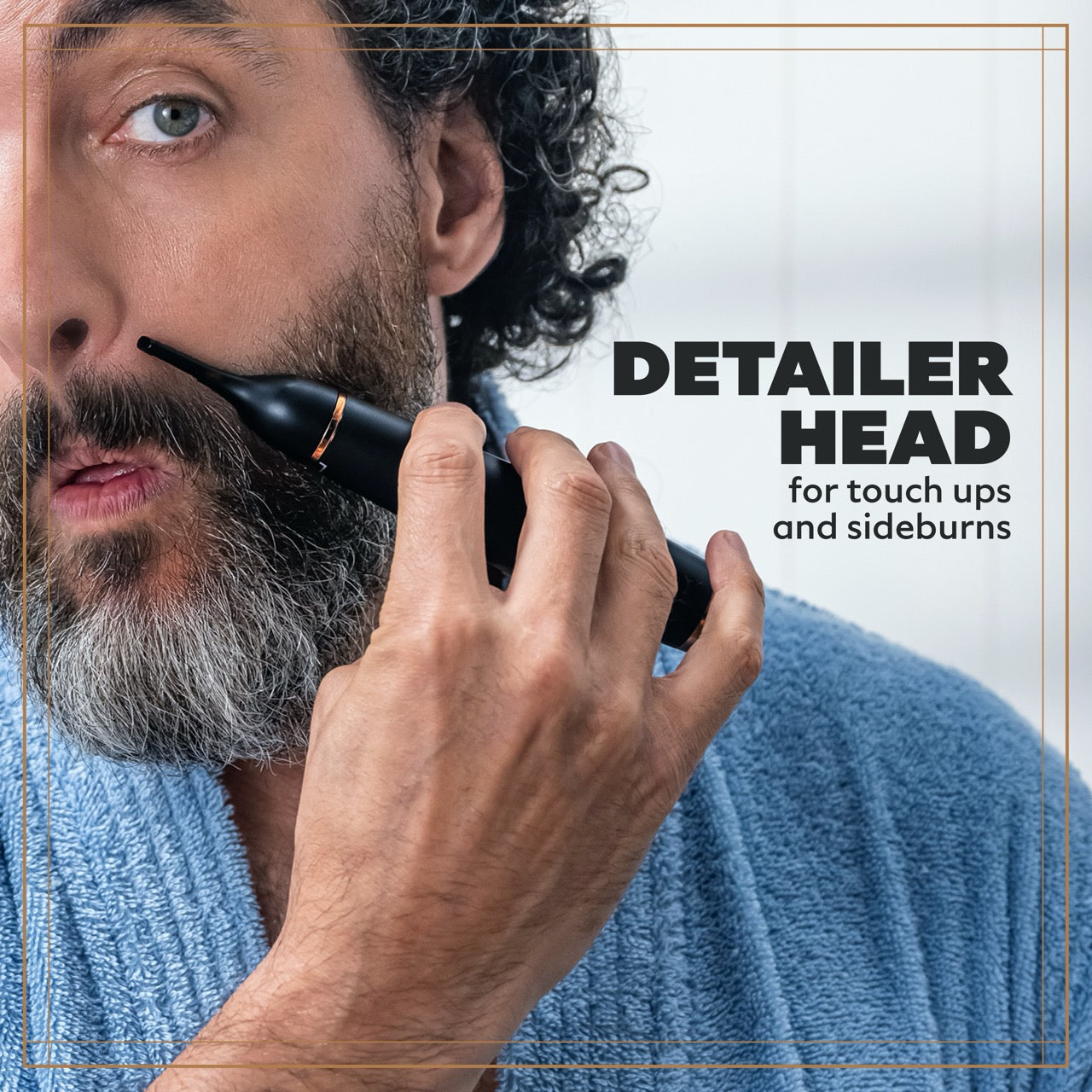 A photo of a bearded man using the Detailer Head of the Style Detailer to touch up his moustache