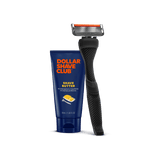 Dollar Shave Club razor and shave butter on a black background