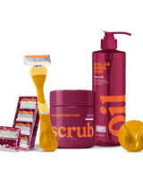 Dollar Shave Club grooming products including a razor, scrub, and shave oil on a black background.