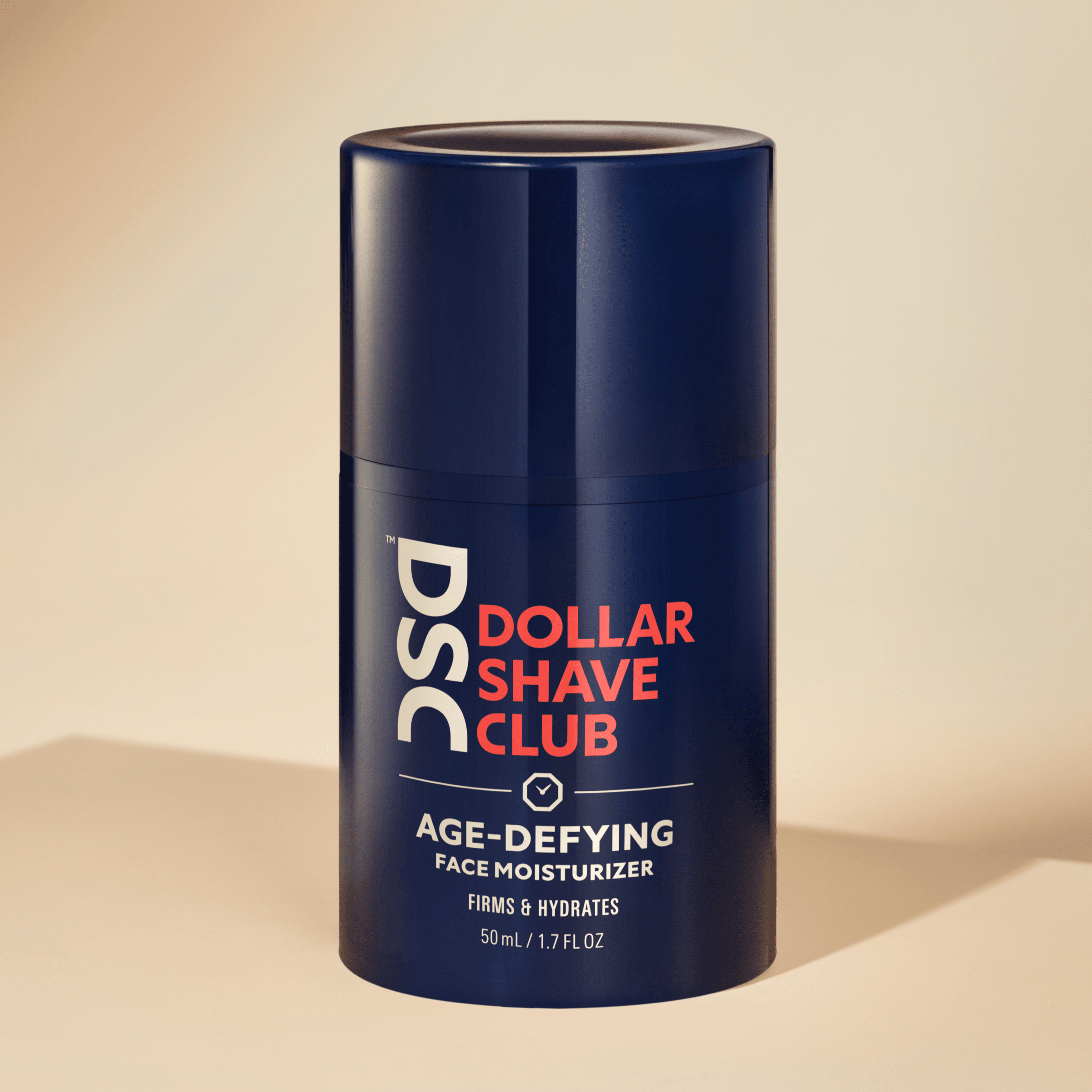 Dollar Shave Club Age Defying Face Moisturizer against tan backdrop.