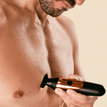 Dollar Shave Club Double Header Electric Trimmer product being used by man to shave body.