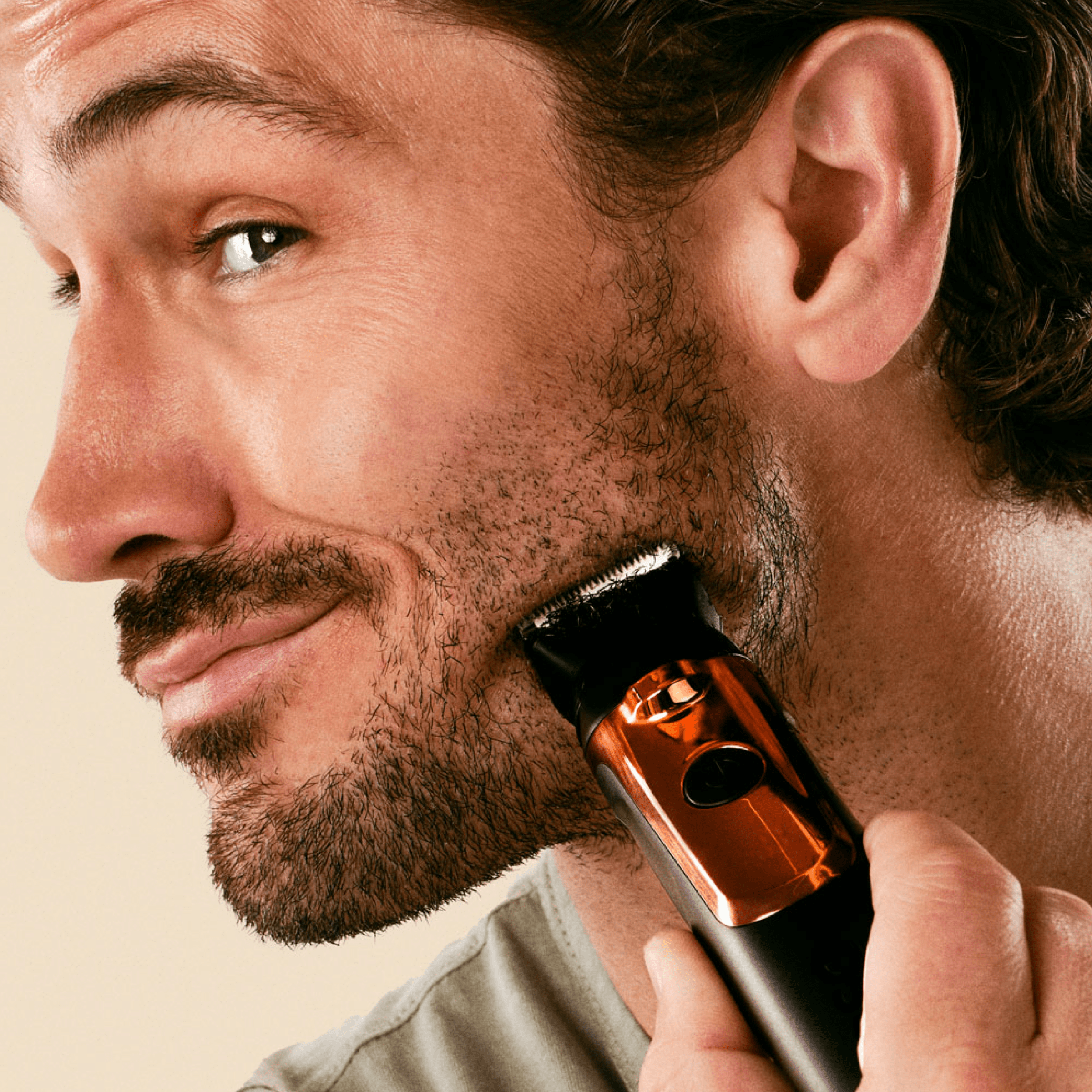Dollar Shave Club Double Header Electric Trimmer product being used by man to shave blade.