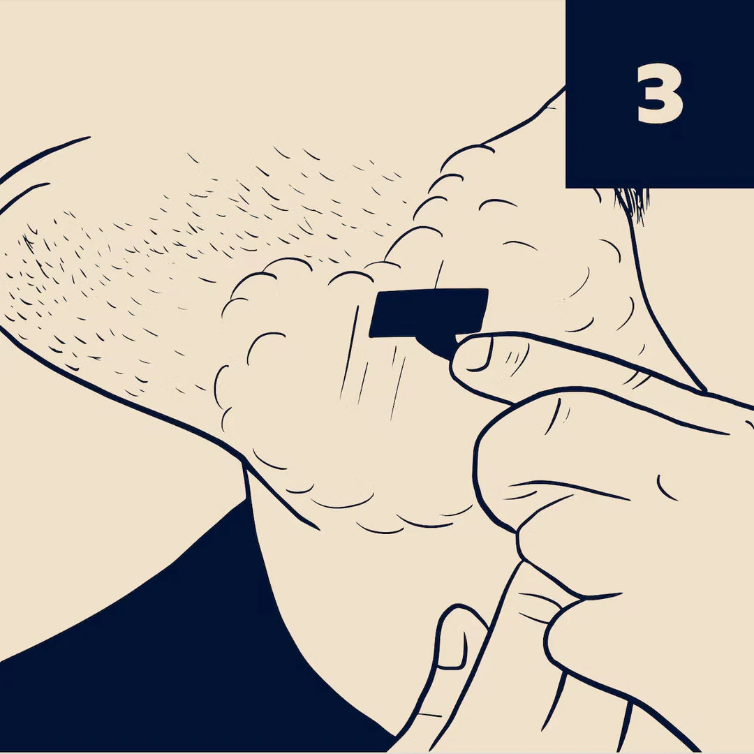 Illustration of man lathering face with shave cream.