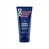 Dollar Shave Club Hand Cream against blank backdrop.