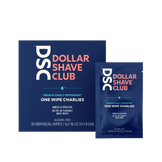 Dollar Shave Club One Wipe Charlies Butt Wipes travel size against tan backdrop.