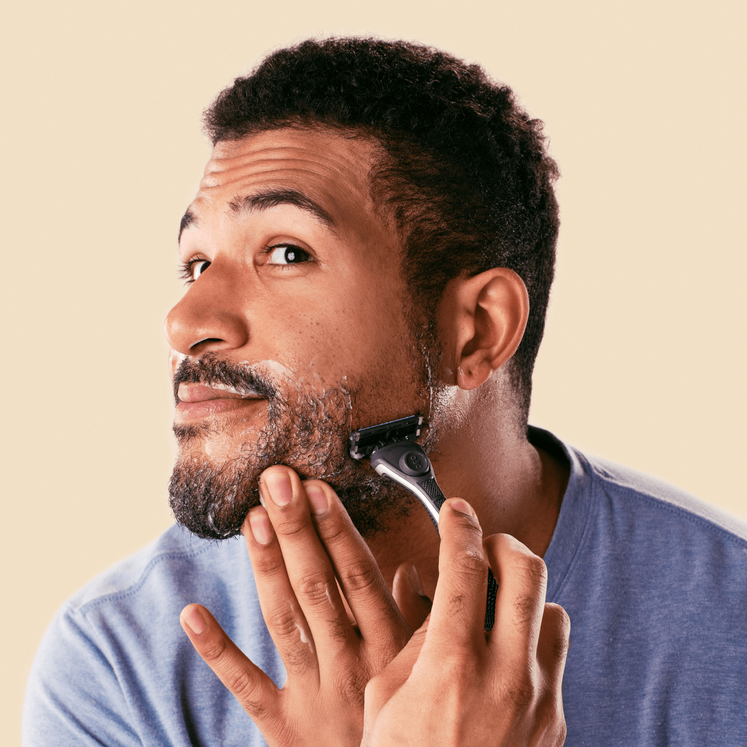 Man shaving with Dollar Shave Club Shave Butter.