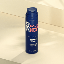 Dollar Shave Club Shave Gel product image against tan backdrop.