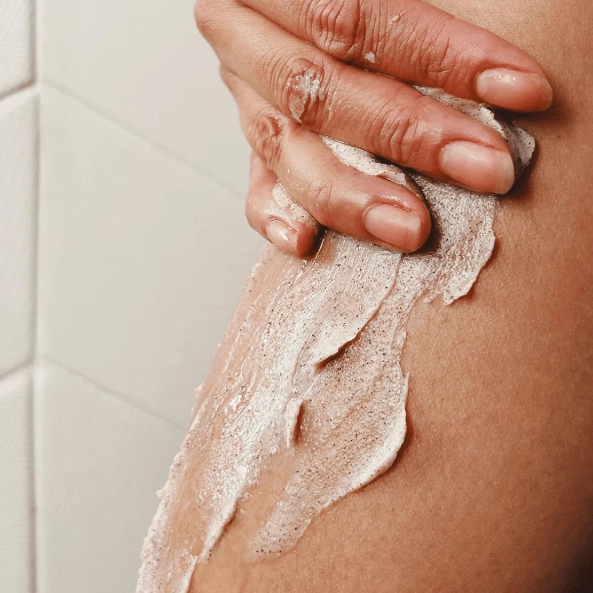 Women's leg with shave cream.